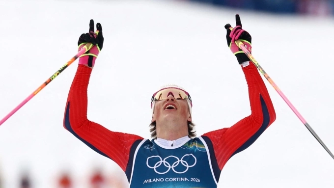 Johannes Hoesflot Klaebo of Norway crosses the finish line to win gold at the Milano Cortina 2026 Olympics, at Tesero Cross-Country Skiing Stadium, Lago, Italy, Feb. 21, 2026. (Reuters Photo)